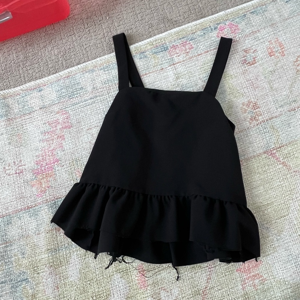 Black flowy tank top with raw hem